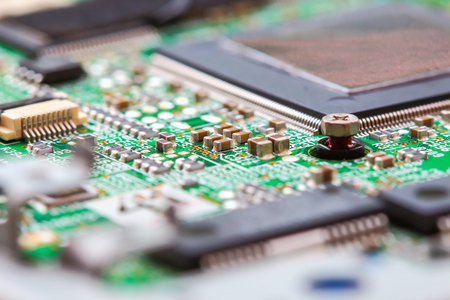 Closeup electronic circuit board background.