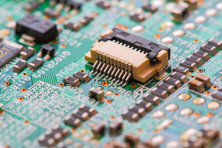 Closeup electronic circuit board background.