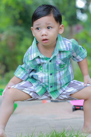 Lovely child  playing outdoors in the morning with freedom.の写真素材