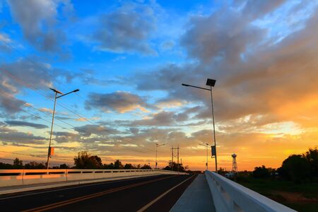 Sunrise. Road bridge across the river.の写真素材