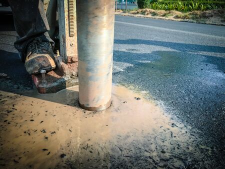 Inspection of thickness measurement of asphalt road.