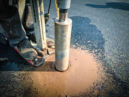 Inspection of thickness measurement of asphalt road.