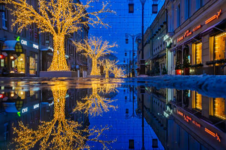 Reflections of Christmas decoration on evening streetのeditorial素材