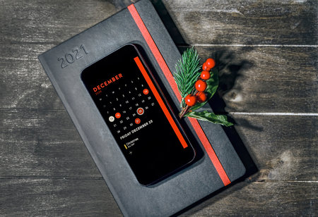 Still life with diary and smartphone with Christmas dateの写真素材