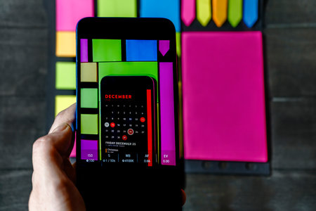 Colorful calendar background on smartphone displaying Christmas dateの写真素材