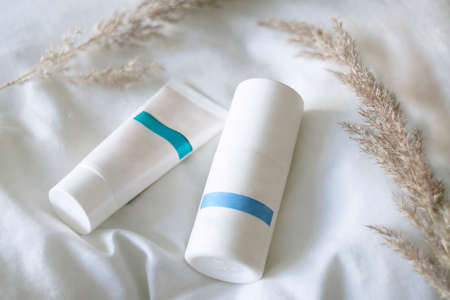 Flat lay composition with deodorant and hands cream