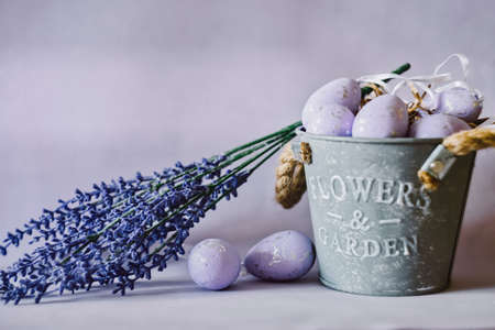 Easter greeting card with purple eggs in basket and lavender