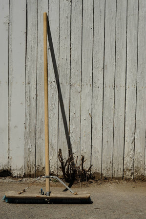 Broom aginst wallの写真素材