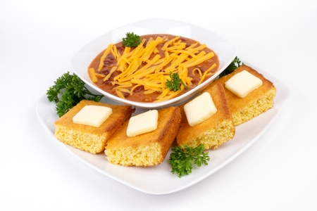 Red Chili and Cornbread Meal on White Dinnerware