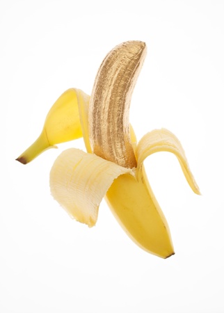Banana Skin Peeled Back to Show Golden Fruitの写真素材