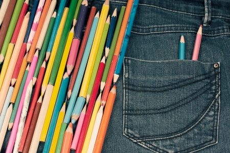 Different kind of pencils on the jeans textureの写真素材