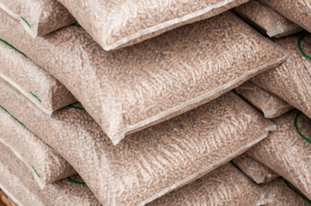 Pile of sacks of pellets, which are stacked on palletsの写真素材