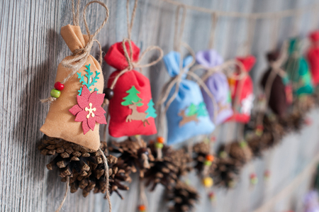 Christmas handmade calendar with bags and conesの写真素材