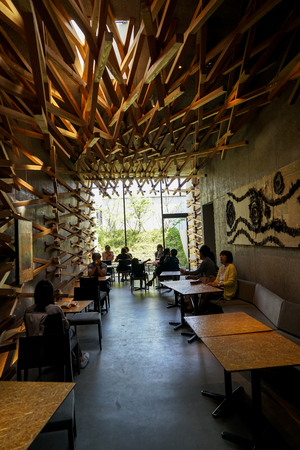 Dazaifu, Japan - May 14, 2017 :Interior design of iconic Starbucks coffee store in Dazaifu with customers, design by Kengo Kuma, famous Japanese architect, Dazaifu, Fukuoka, Kyushu, Japanのeditorial素材