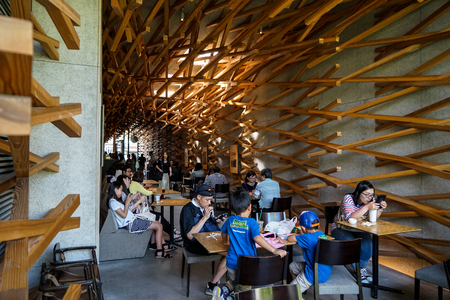 Dazaifu, Japan - May 14, 2017 :Interior decoration atmosphere of iconic Starbucks coffee store in Dazaifu with customers, design by Kengo Kuma, famous Japanese architect, Dazaifu, Fukuoka, Kyushu, Japanのeditorial素材