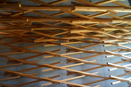 Dazaifu, Japan - May 14, 2017 :Interior design decorated ceiling through wall by woven natural cedar wood of iconic Starbucks coffee store in Dazaifu, design by Kengo Kuma, famous Japanese architect, Dazaifu, Fukuoka, Kyushu, Japanのeditorial素材