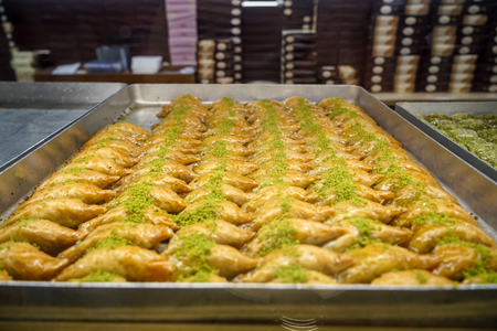 Authentic sweet Baklava, traditional turkish famous delicious dessert in tray showcase of local shop in Istanbul, Turkeyの写真素材