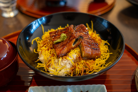 Delicious Unadon, Kabayaki, grilled ell with sweet sauce and egg on cooked white rice, popular japanese dish, Kyoto, Japanの写真素材