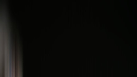 abstract black background with some smooth lines in it and some motion blurの写真素材