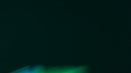 abstract green background with some smooth lines in it and some spots on itの写真素材