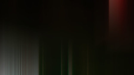 Abstract vertical motion blur effect. Light and shadow on black background.の写真素材