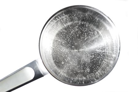 Scoop with boiled transparency waterの写真素材