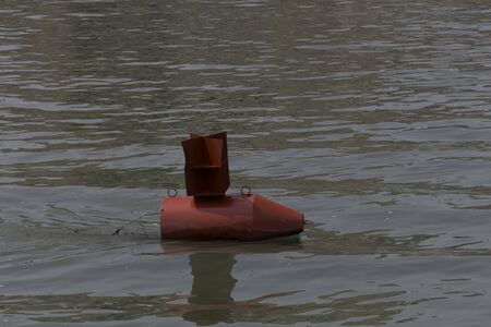 Red buoy in a river