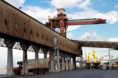 Crane and logistic way just near to riverの写真素材