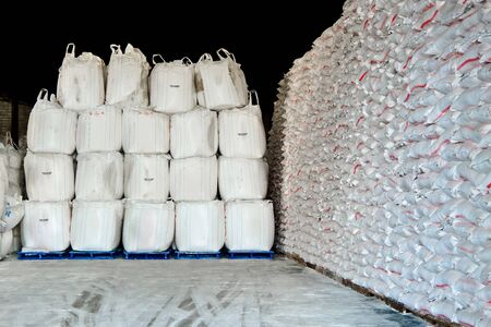 Stack of white Sack in a warehouseの写真素材
