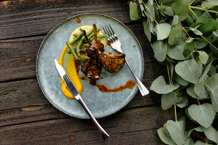 Delicious Lamb chops and couscous on wooden tabletopの写真素材