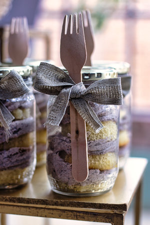 Vanilla cupcake jars with wood forkの写真素材
