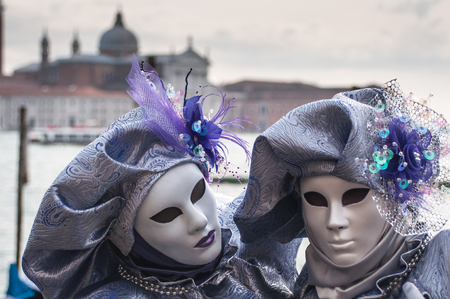 Purple venice mask costume church bay backgroundの写真素材