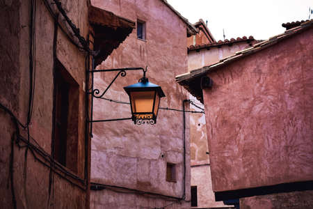 Old iron lamppost in a street of the medieval town of Albarracin