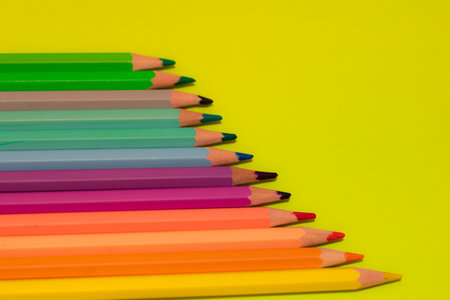 Color pencils on green background.Copy spaceの写真素材