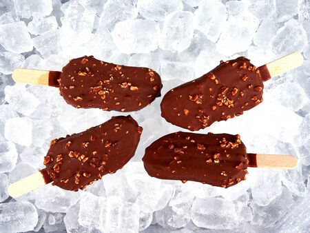 Ice cream lollies set on a bed of ice cubes
