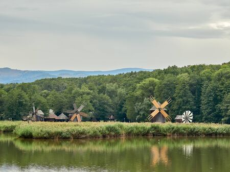 Sibiu, Romania - September 23, 2019: Traditional windmills from Romania on the Dumbrava lake, at the ASTRA Ethnographic museumのeditorial素材