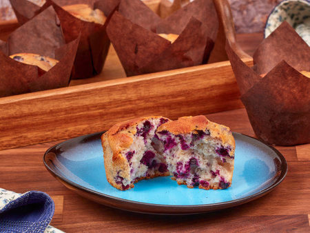 Ricotta and blueberry muffin on a blue plateの写真素材