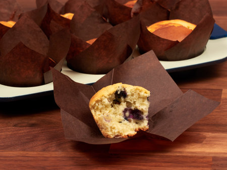 Ricotta and blueberry muffins in a gray muffin tray.の写真素材