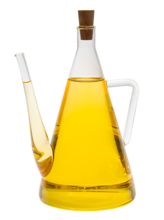 A jug of cold pressed sunflower oil on white backgroundの写真素材
