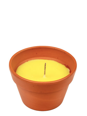 Yellow citronella candle, new, in a clay pot. A mosquito repellant for outdoor use.の写真素材