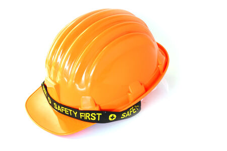 the orange safety hat with the black bandの写真素材