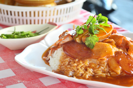 BBQ Pork, sausage and crispy pork over the rice, thai food style の写真素材