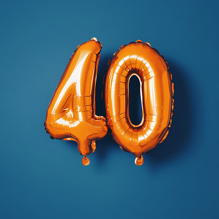 Two orange foil balloons, one forming the number 4 and the other the number 0, against a blue...