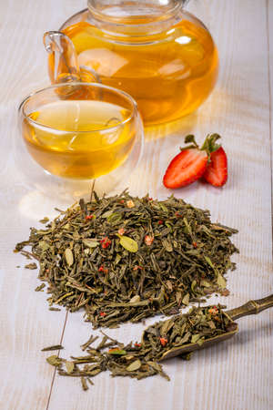 Chinese green oolong tea with fruit additives, selective focus on dry tea leaves, close-upの写真素材