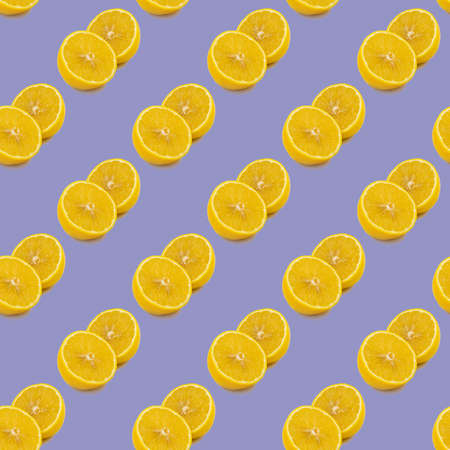 Seamless pattern of fresh ripe orange round cut wedges on lavender purple background, 17-3938 very...