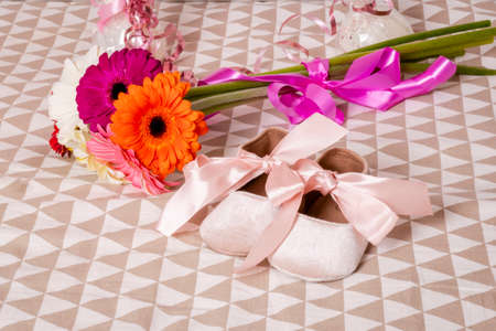 Balloons, gerbera flowers, birthday presents for a little girl 1 year old. Pink decorations for a birthday party. postcard.の写真素材