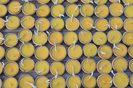 Yellow candles in terracotta pot on Loy kathong festival Thailandの写真素材