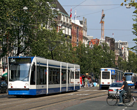 A tram on a busy street in Amsterdam, Hollandのeditorial素材
