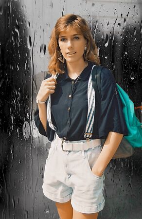 Young female posing with a backpackの写真素材