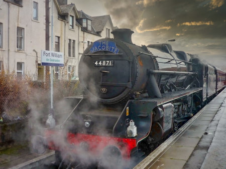 A Jacobite steam locomotive passing through Fort William in the western Scottish Highlands, Scotlandのeditorial素材
